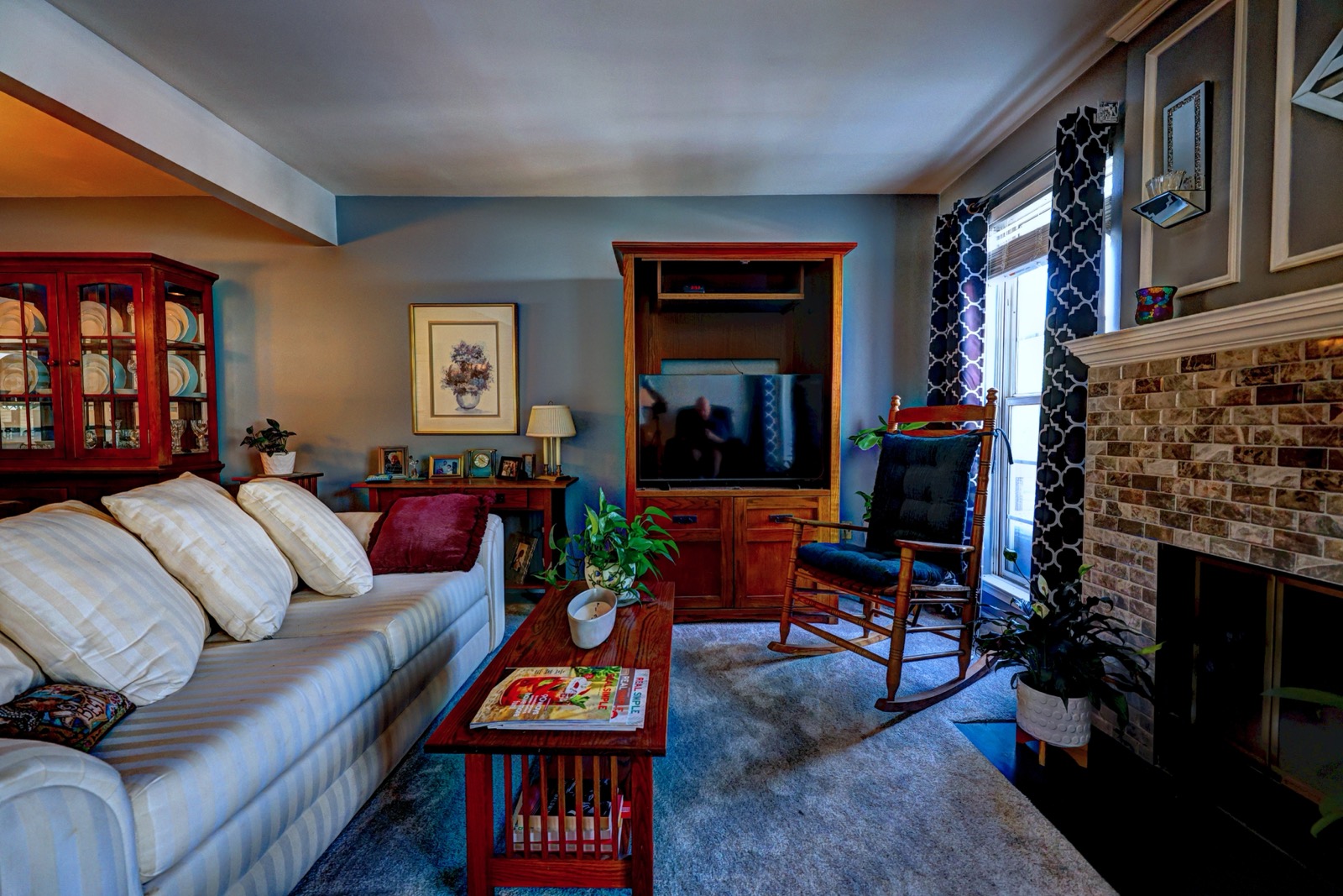 Living room with stone fireplace
