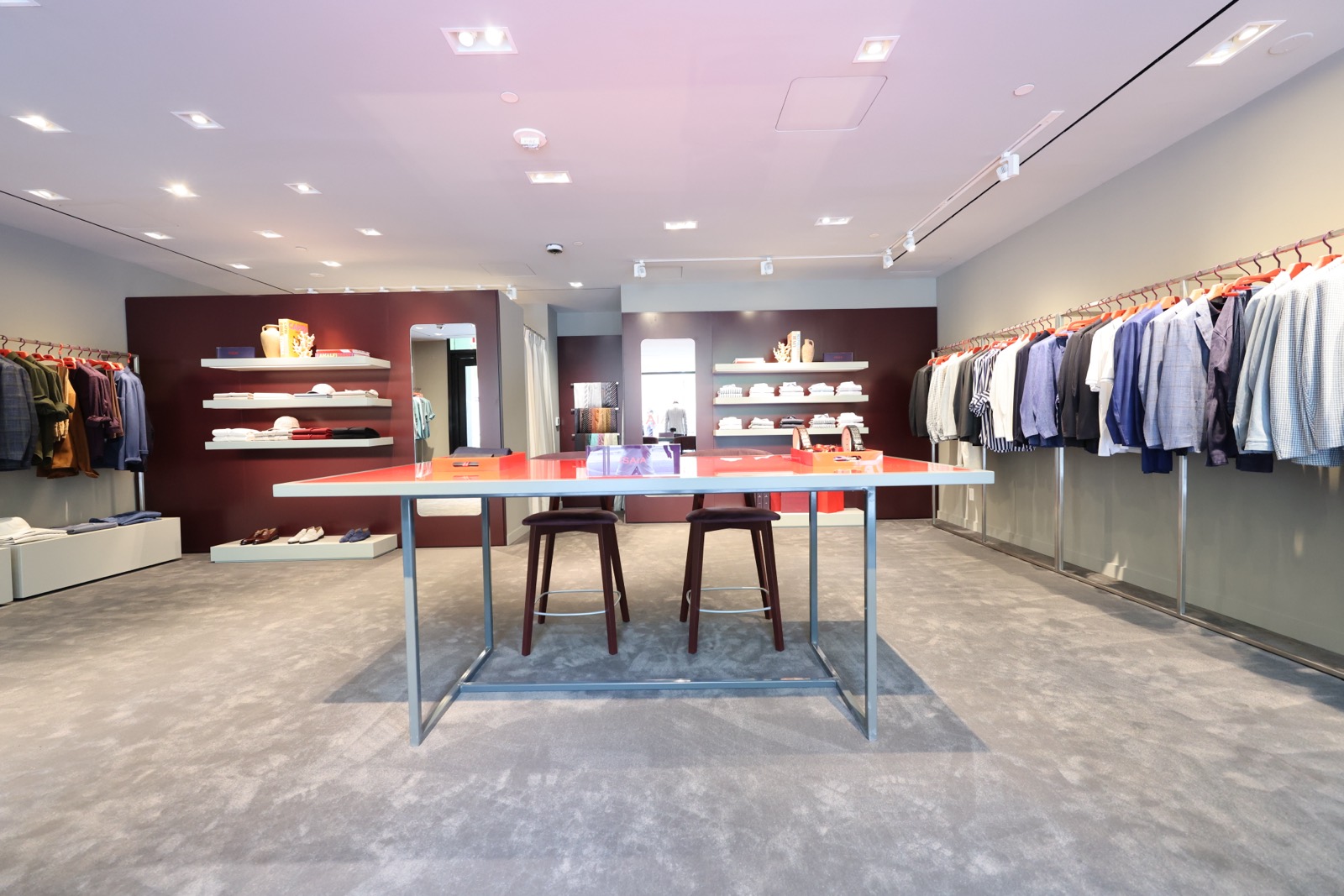 Isaia showroom with the signature red table